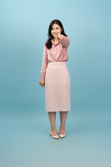 Asian girl is posing in front of a background