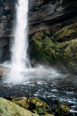 A Majestic Waterfall Cascading Gracefully into a Tranquil Pool