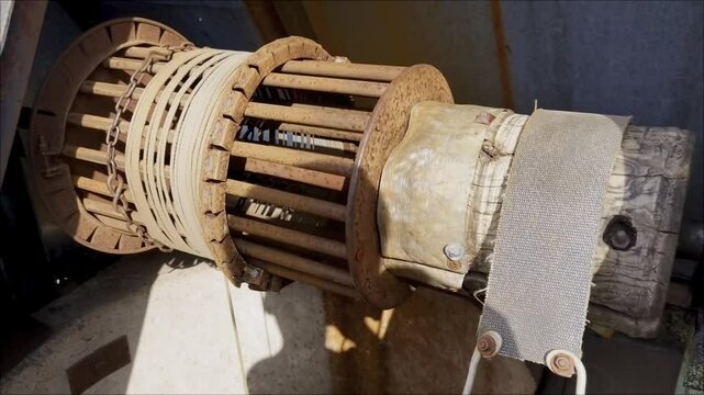A close up of a winch with a chain attached to it