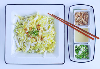 Asian Salad with Green Onions, Toasted Toppings, Dressing and Chopsticks