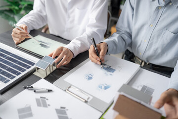 Solar panels green energy Business man working green eco friendly office business creative idea Planing Bio economy for business eco friendly professional Engineer sustainable electricity.