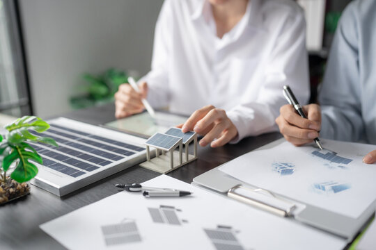 Solar panels green energy Business man working green eco friendly office business creative idea Planing Bio economy for business eco friendly professional Engineer sustainable electricity.