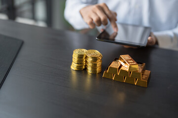 Gold Trading business man hand offering gold Investment in gold mining company or Trading gold on the stock exchange Rising gold prices.