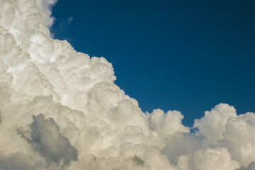 Rain clouds forming on blue Florida sky. Colorful summer skyscape