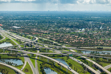 USA car urban transportation infrastructure. American highway junction with fast driving vehicles...
