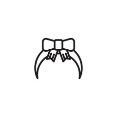 A headband with a large, decorative bow at the center.