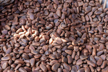 Pine nuts in wooden barrel