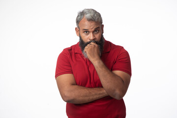 Obraz premium Indian senior man doubtful unsure looking copyspace isolated on white background