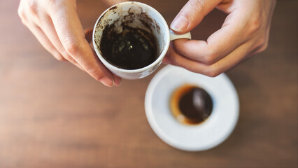 A fortune told by inspecting the grounds remaining in one's coffee cup