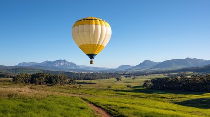 Naklejka premium Hot air balloon soaring over picturesque landscape serene travel and adventure image