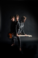 A moody, artistic capture of a bassist in motion, layered with dramatic lighting and raw rock energy, lost in rhythm and expression