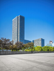 Contemporary Urban Landscape with Towering Skyscraper and Greenery