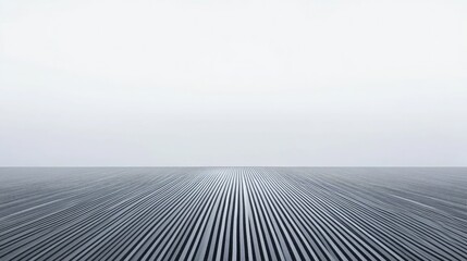Stark contrast of white lines and dark asphalt beneath a sky full of fog