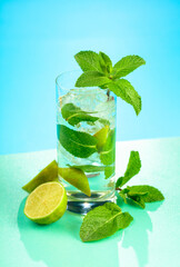 Mojito cocktail with ice, lime and mint.