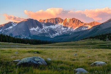 Sunrise over the Mountain Range: A majestic mountain range peaks through a vast, golden-hued sky as the sun bathes the landscape in a warm, inviting glow.  