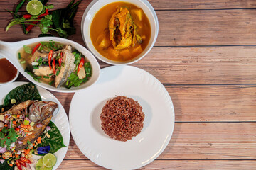 Thai Cuisine: Fried Fish, Soup, and Rice on Wood Table, Food