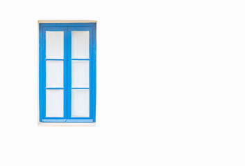 White wall with a turquoise window and white curtains behind it