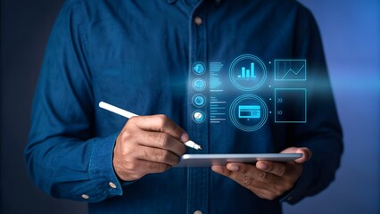 Businessman analyzing digital financial data using tablet with stylus in blue tone