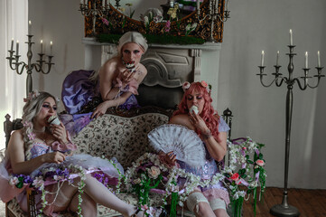 A girl dressed in the style of a Victorian boudoir, in a corset and crinoline of lilac color, in flowers