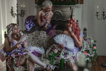 A girl dressed in the style of a Victorian boudoir, in a corset and crinoline of lilac color, in flowers