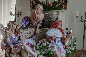 A girl dressed in the style of a Victorian boudoir, in a corset and crinoline of lilac color, in flowers