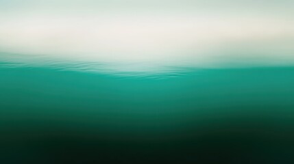 Obraz premium Ocean water surface with gentle waves reflecting sunlight, tranquil underwater scenery, peaceful aquatic environment, serene blue colors, nature landscape background.