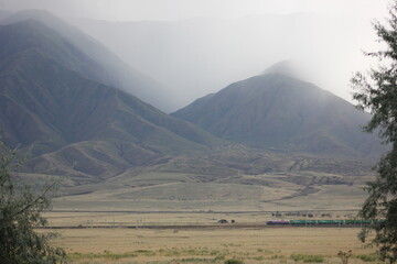 plain. mountains, fog. fog settles from the mountains into the valley before the weather changes