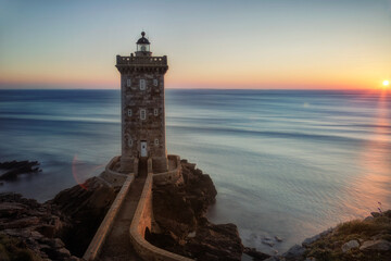 a lighthouse in the sunset