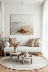 Minimalist living room with beige sofa, round tables, and abstract art