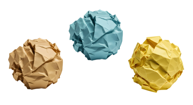 Three crumpled paper balls in brown, blue and yellow colors placed on a white background used to represent failure, creativity or idea development in office or art visuals