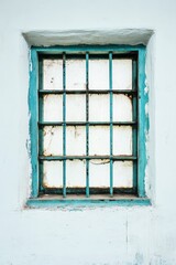 Obraz premium Weathered Teal Window with Rusty Bars on White Wall