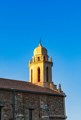 Greek church Saint-Spyrido, Cargèse, Corsica, France. Typical and picturesque hillside village. Hilltop town nestled on the coast above the Mediterranean sea.