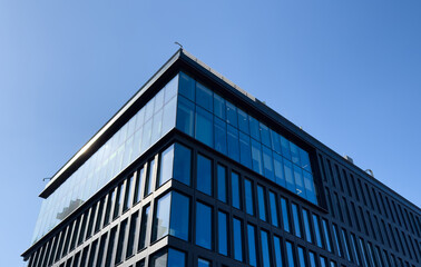 Fototapeta premium Architecture details Glass wall Modern building exterior Abstract futuristic background