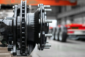 A black and silver wheel with many bolts on it