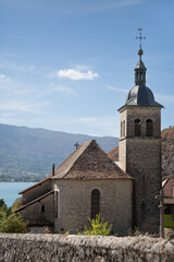 Fototapeta premium Église Saint-Maurice de Talloires Near Lake Annecy, France – Historic Church on a Sunny Day