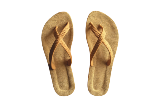 Golden brown leather flip flop sandals with crossed straps on white background for summer footwear