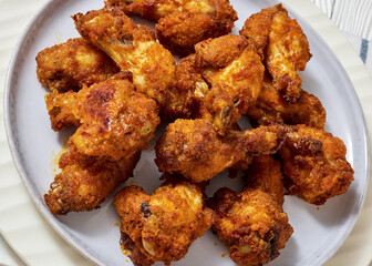 crispy fried chicken wings on a plate