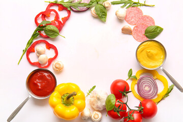 Frame made of ingredients for preparing pizza on white background