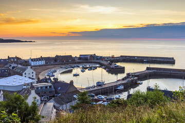 Fototapeta premium Stonehaven harbour at sunrise. Stonehaven is a picturesque harbour town in Aberdeenshire lying to the south of Aberdeen on Scotland's north east coast. 