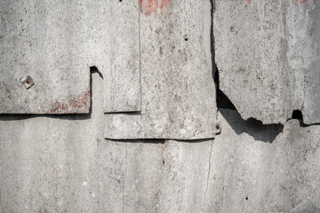 Old and very dangerous asbestos roof. Asbestos dust in the environment. Asbestos removal