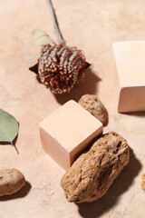 Composition with plaster podiums, stones and dried flower on color background, closeup