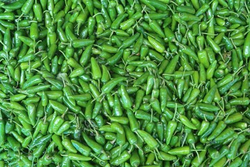 Shishito peppers or chilli peppers in the background	