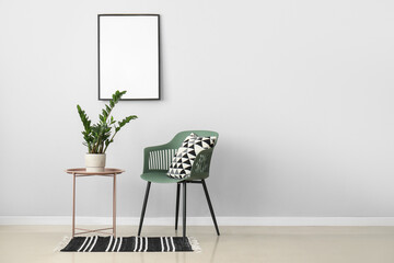 Green plant on table and chair in light room