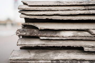 Old and very dangerous asbestos roof. Asbestos dust in the environment. Asbestos removal