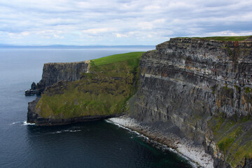 Steep coastal cliffs above the ocean