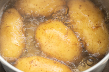 Potato boiling in hot water, Close-up