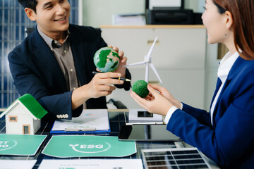 Business team people planning hand using laptop for working technology and business Net zero and...