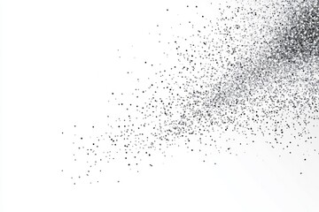 Obraz premium A close-up of a black powder or dust explosion against a white background. The particles are scattered in a random pattern