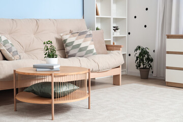 Interior of modern living room with cozy sofa and coffee table