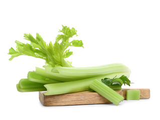 Wooden board with fresh green celery on white background